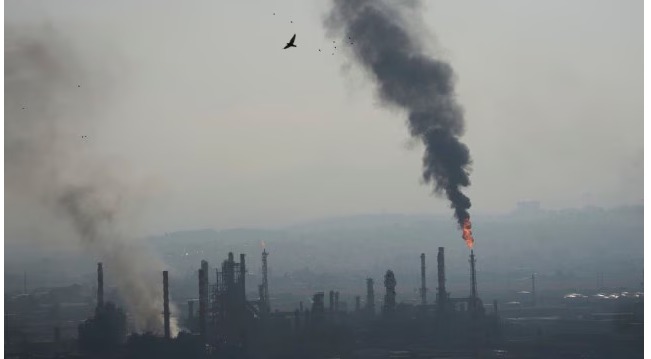 “Indian student in Israel sitting in bunker with notebook, surrounded by emergency supplies during conflict”
